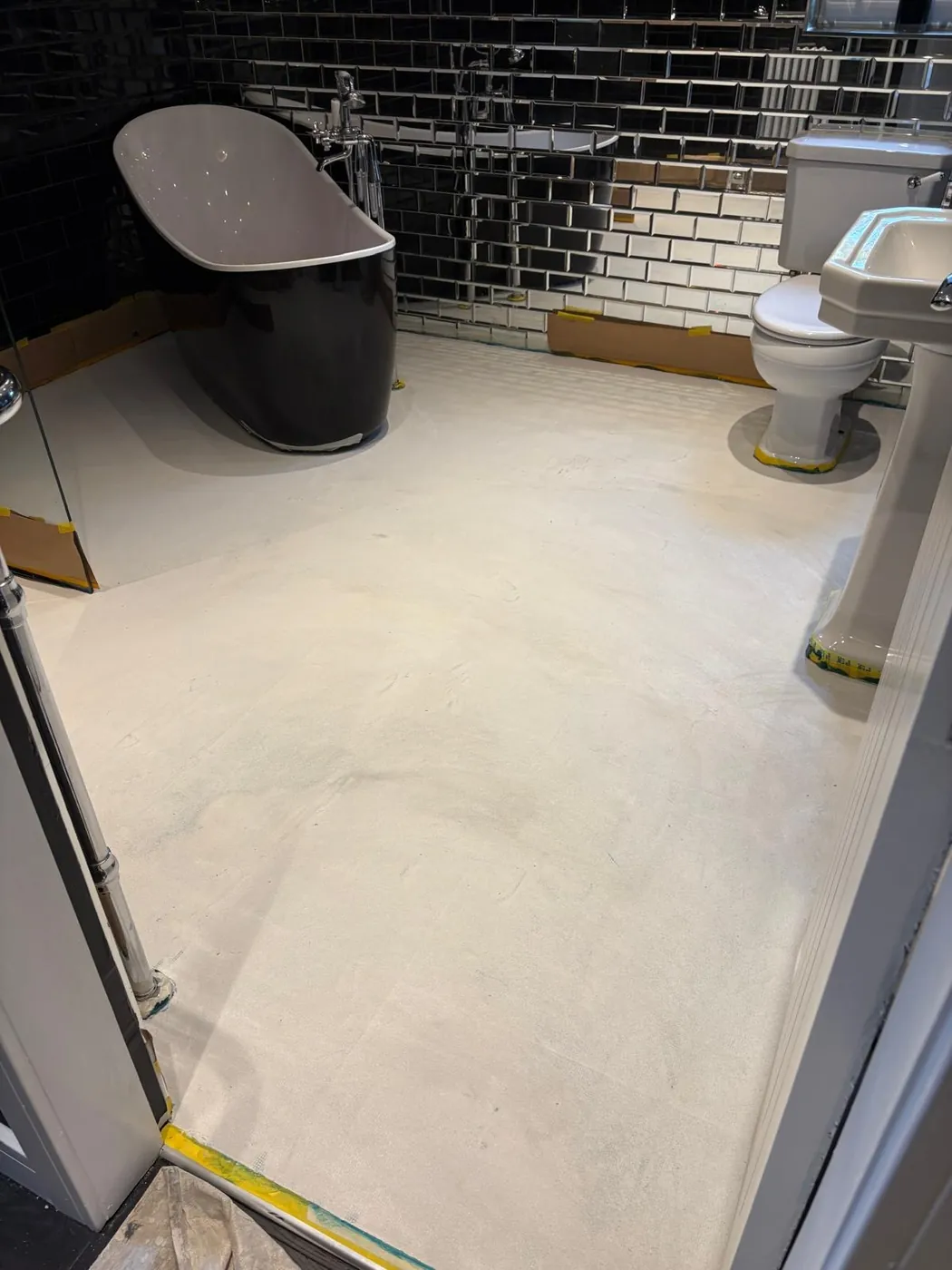Microcement bathroom floor being applied by Glasgow Microcement (photo 3)
