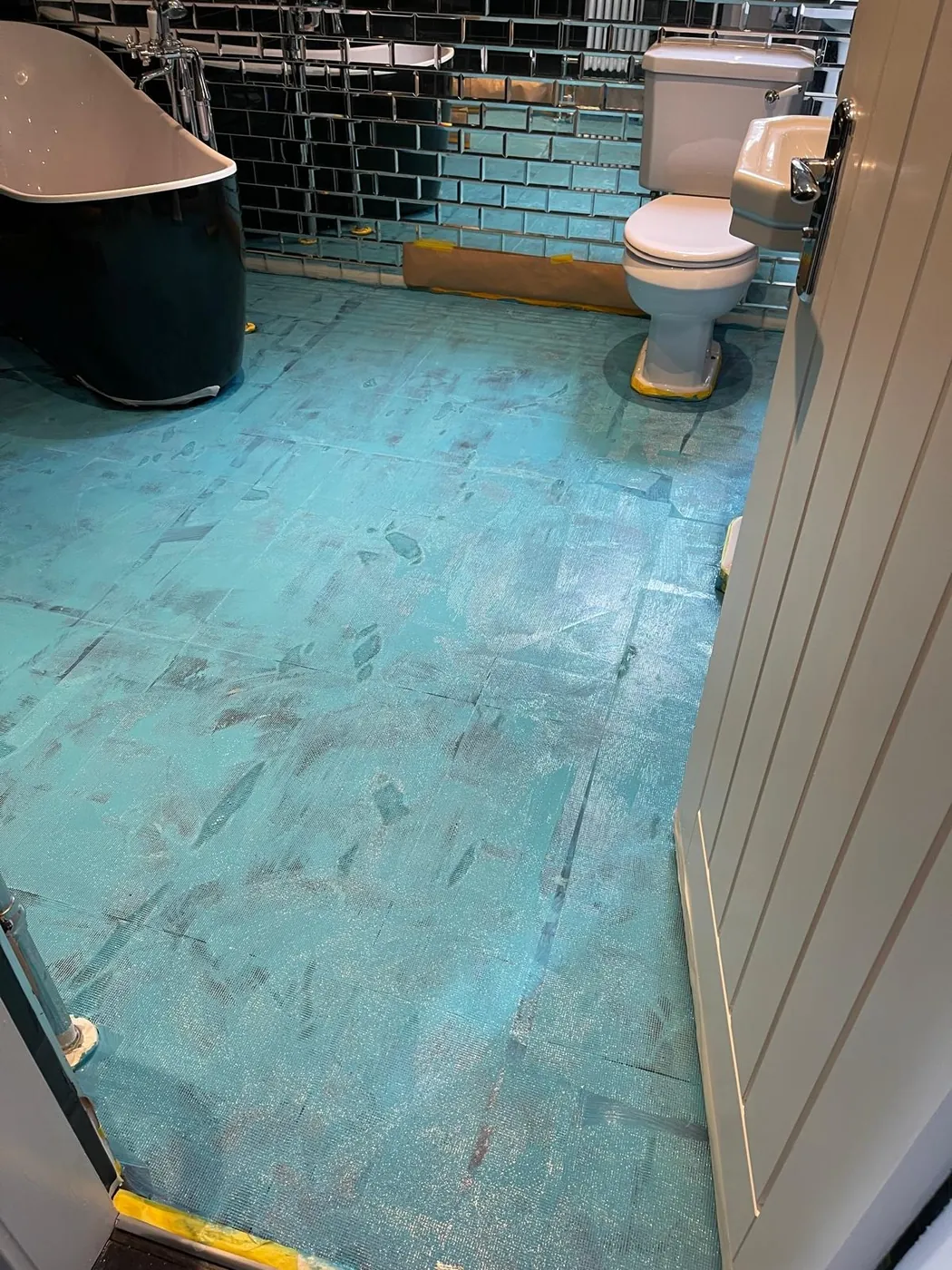 Microcement bathroom floor being applied by Glasgow Microcement (photo 5)